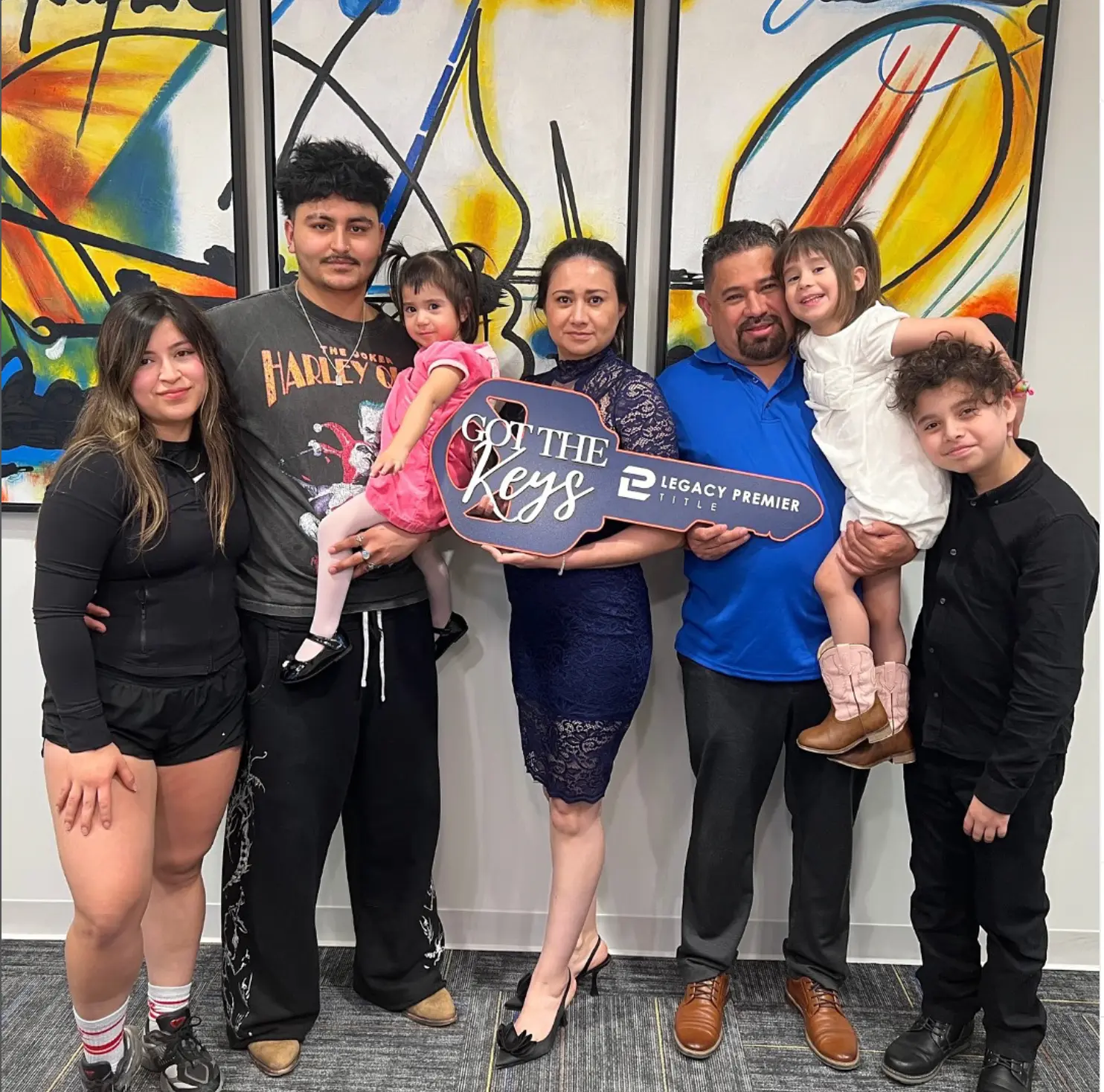 A family celebrating their home purchase at Legacy Premier Title