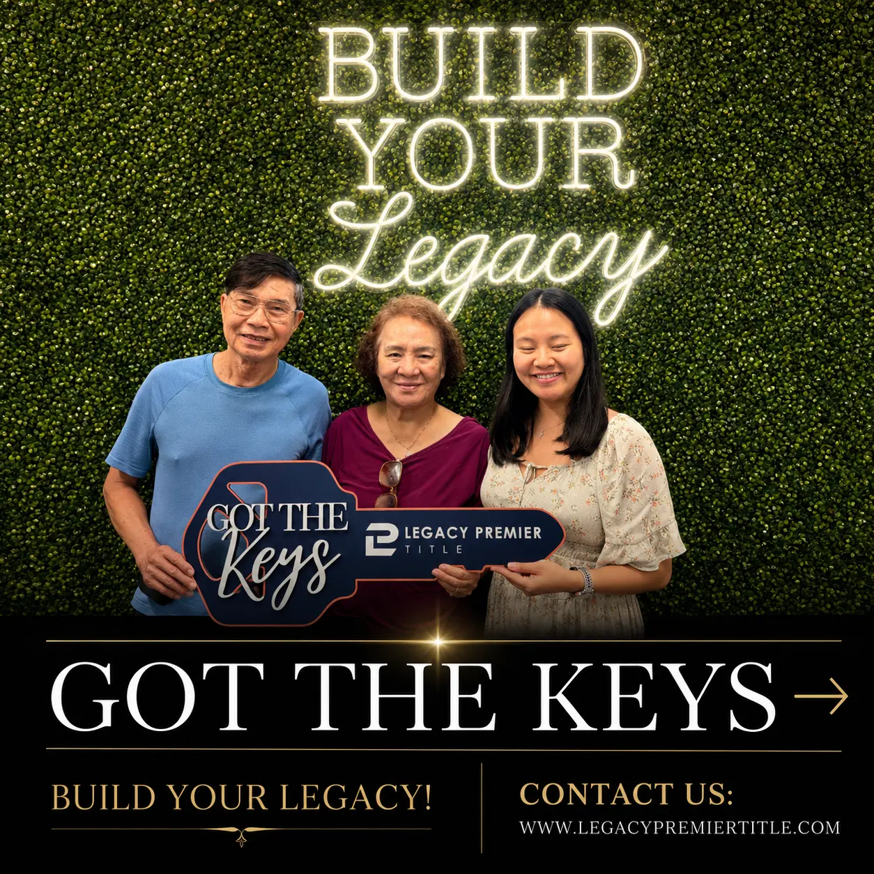 A family holding the Got the Keys sign at Legacy Premier Title