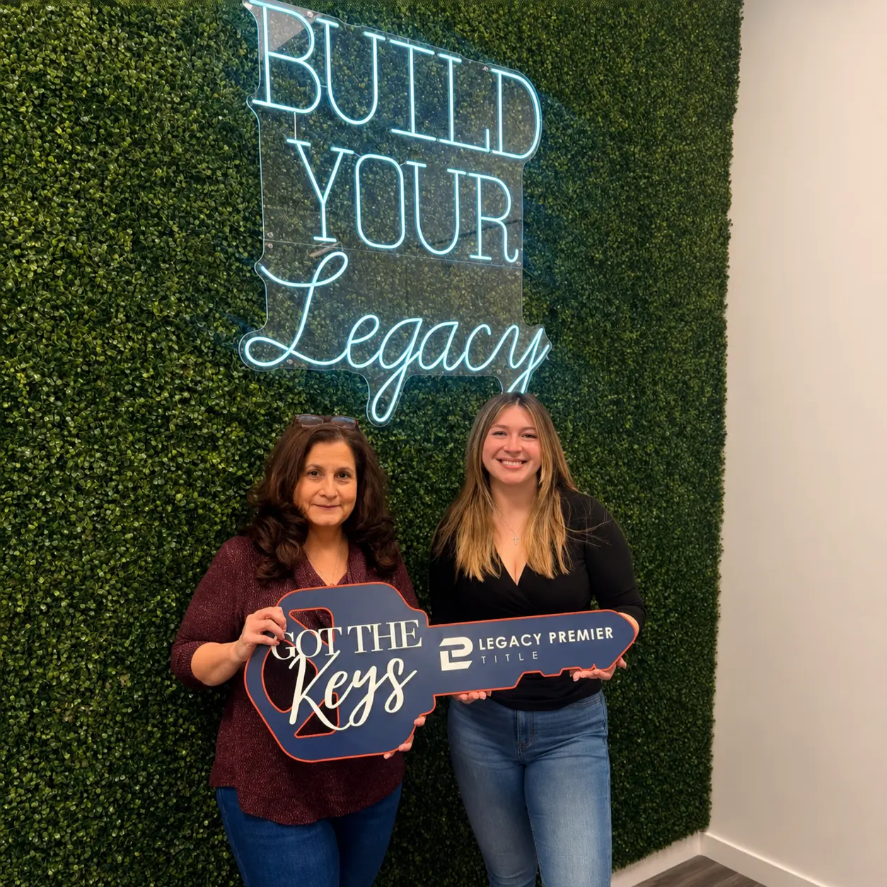 Legacy Premier Title clients celebrating with the Got the Keys sign