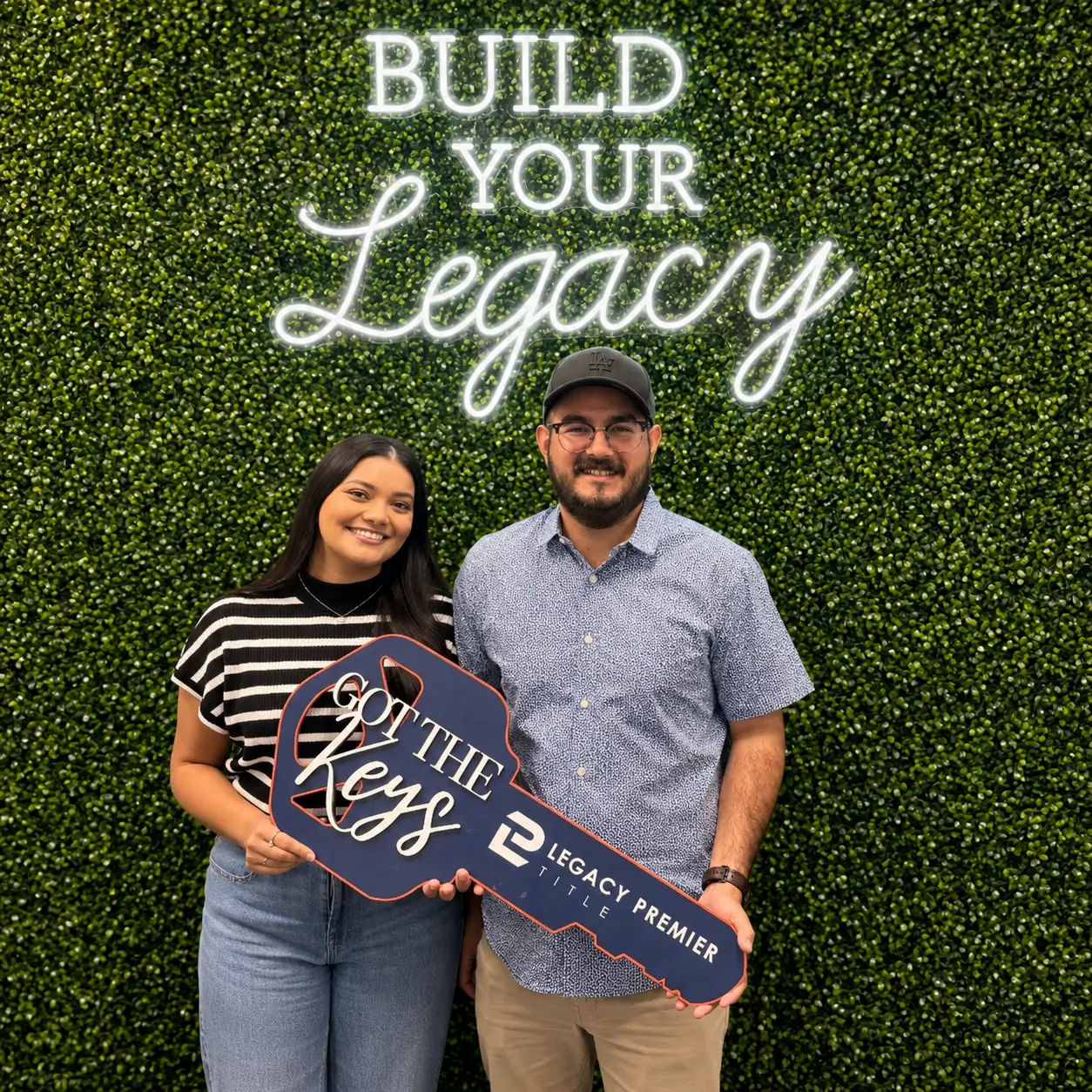 New homeowners at the Build Your Legacy wall